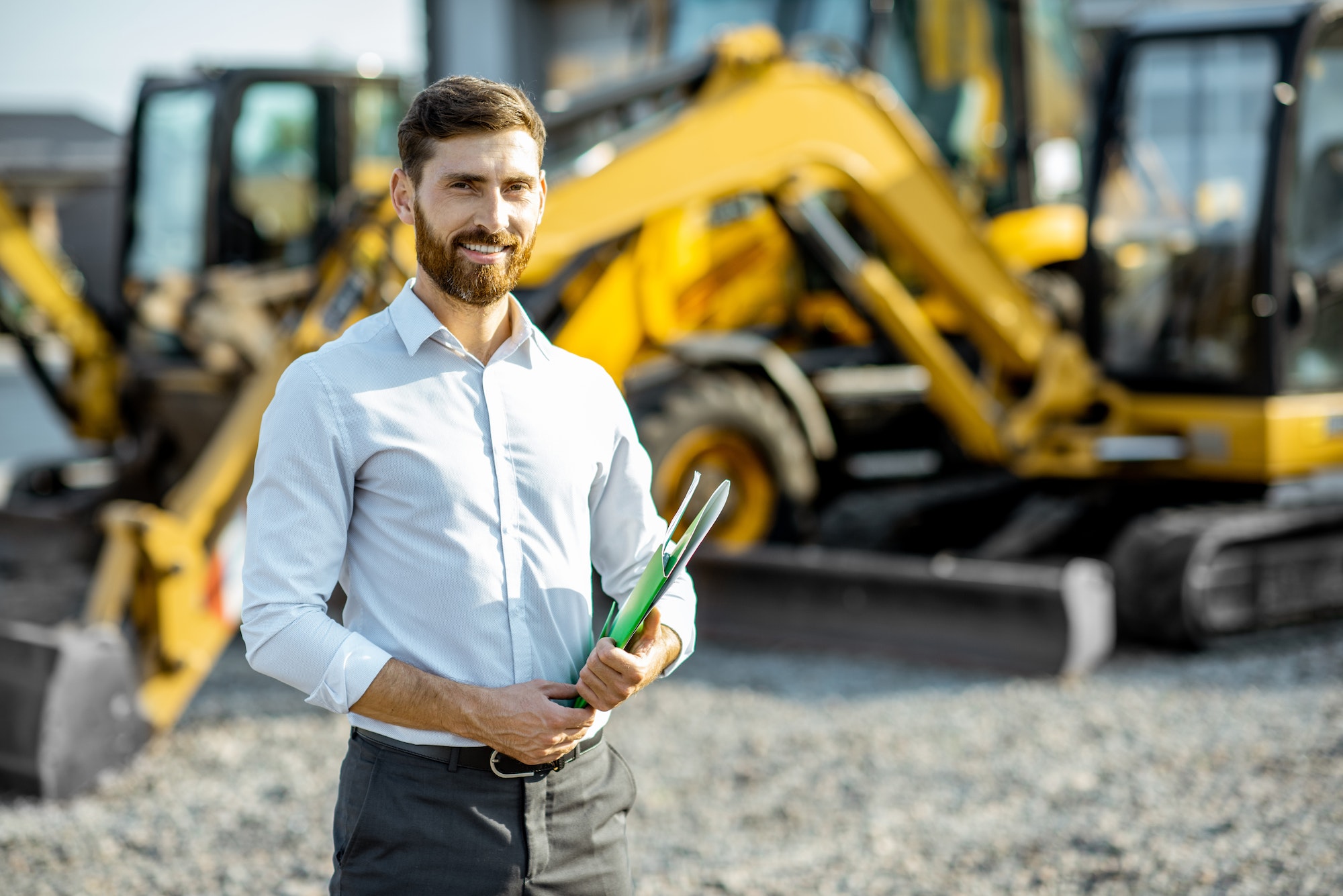 Salesman at the shop with heavy machinery